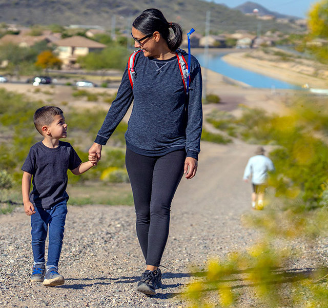 Mother and son walking on CAP Trail